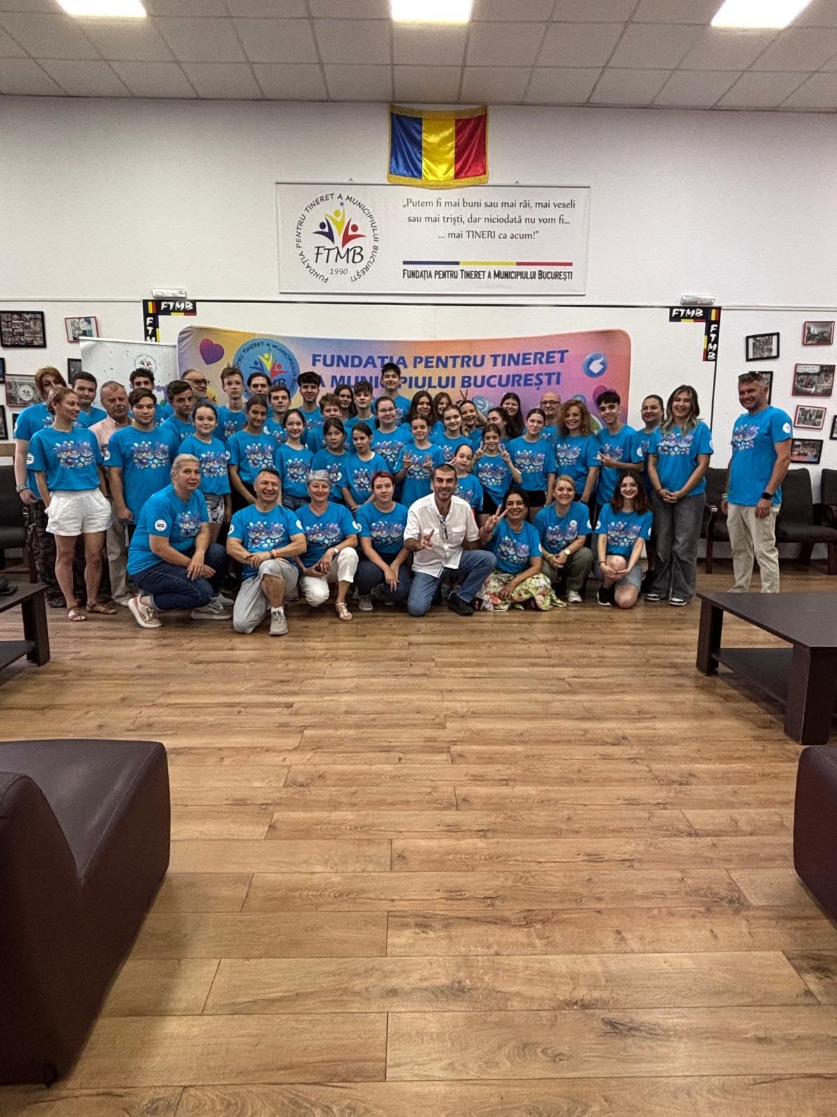 Large group of young people, volunteers and staff gathered in the foundation hall